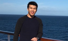 Front-end developer and Web designer, Maurice, standing near a rail on a cruise ship in the coast of the beautiful California.