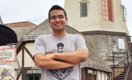 Front-end Developer, Walter, standing in front of a windmill looking like a badass in Solvang.
